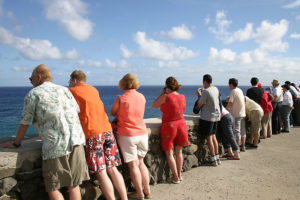 Hawaii tourist at a lookout point on the water